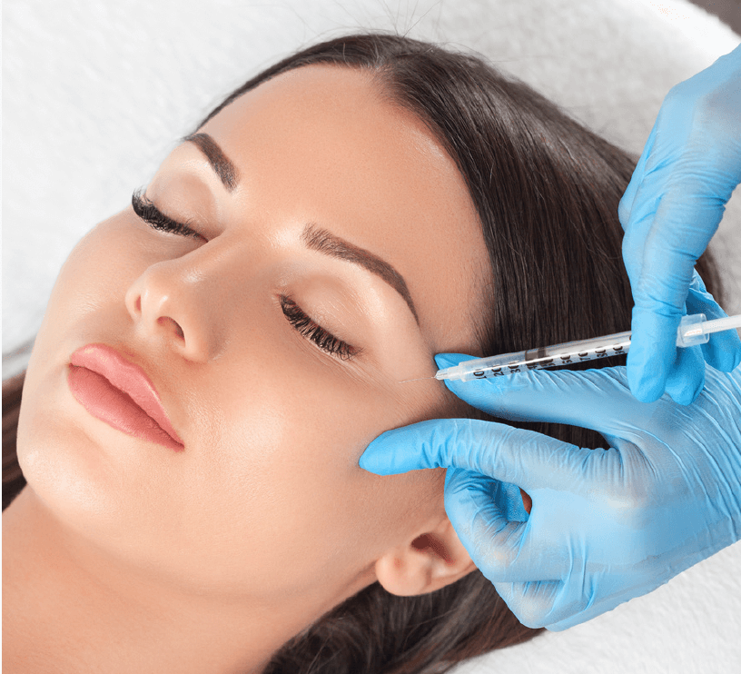 Injection near temple of face of reclined woman